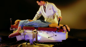 This is a picture of Cox Technic chiropratic spinal manipulation as performed at Dr. Le's Chiropractic & Wellness, L.L.C..